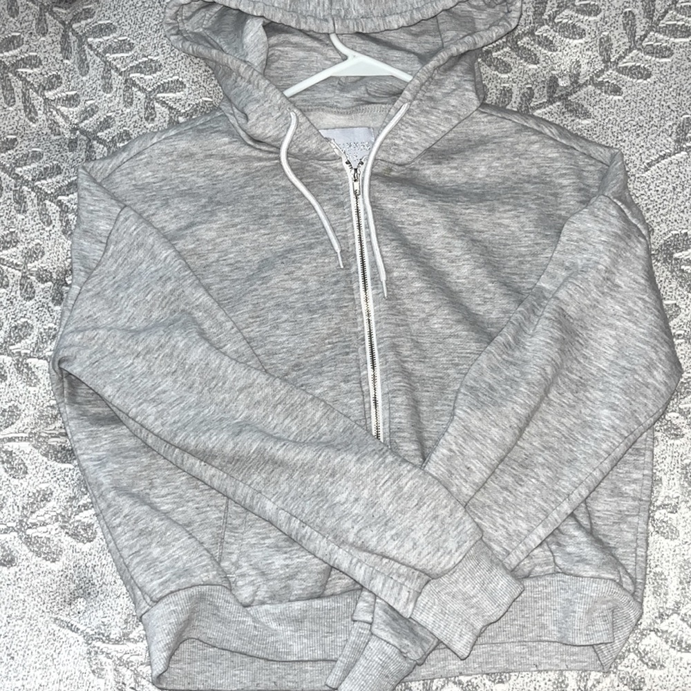 Worn a few times, one tiny stain by the neck